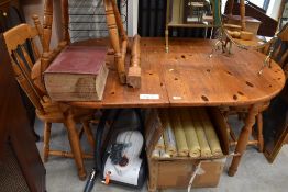 A traditional pine kitchen table of oval form, length approx. 150cm , 1 leg damaged, should repair
