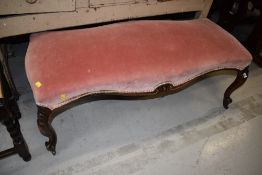 A French style dralon upholstered duet stool, on cabriole legs and brass casters , approx. Width