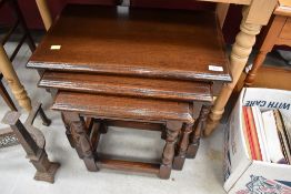 A lovely quality reproduction (Reprodux) nest of three traditional oak tables, in excellent