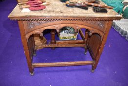 A heavily carved gothic styled Ecclesiastical vestibule table, approx 90cm height, 104cm width, 54cm