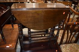 A nice quality traditional oak gate leg table, having bobbin turned legs, good proportions being