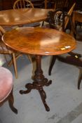 A beautiful Victorian burr walnut occasional oval pedestal table on carved column and triple splay