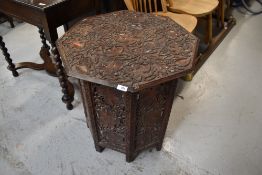 An Arts and Crafts carved folding table, really detailed foliate carving, diameter approx. 62cm