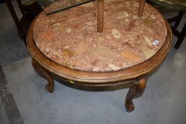 A traditional continental style circular coffee table having rouge marble inset top, width approx.