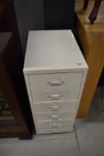 A set of six narrow filing drawers