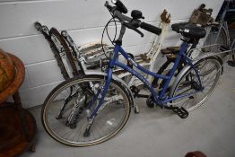A modern Peugeot bike, labelled BUS (Between US)