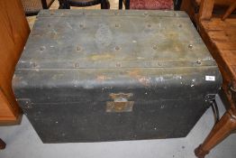 A traditional tin trunk having studded decoration
