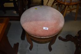 A Continental style mahogany and oak piano stool having adjustable seat, circumference approx. 42cm