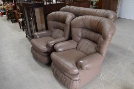 A vintage light brown leather three seater settee and two chairs