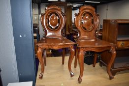 A pair of 19th Century mahogany shield back hall chairs