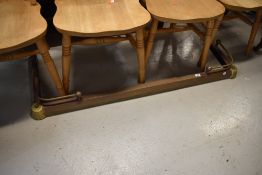 A vintage brass and copper fire fender, adjustable width