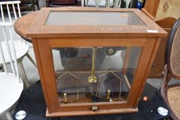 An early 20th Century cased set of lab scales, labelled Griffin and George