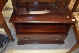 A mahogany effect low TV cabinet, approx. width 68cm