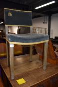 A Elizabeth II Coronation chair by with blue upholstered velvet panel back with ‘ER’ monogram and