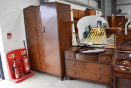 A mid 20th Century oak and ply wardrobe and dressing table