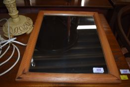 A stripped pine wall mirror, approx 42 x 34cm