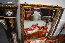 A modern gilt effect wall mirror, approx. 105 x 71cm