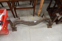 A vintage cast serpentine fronted fire front or fender