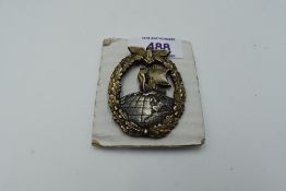 A German WW2 Kriegsmarine Auxiliary Cruiser Badge, marked on reverse Wernstein Jena