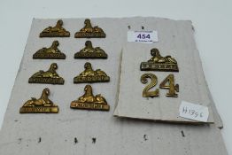 Four pairs of Sphinx Collar Badges and a Sphinx and 24 Forage Cap Badge