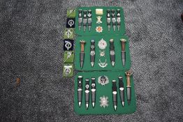 A collection of Scottish Highlanders Sgian Dubh (black dagger), 16 in total on 3 boards along with