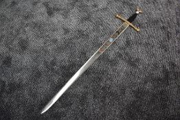 A Reproduction Broadsword made in Toledo Spain having decoration to both sides of blade, blade