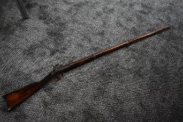 A Percussion Musket in AF condition, barrel rusty, stock used, wall hanging piece, barrel length