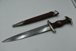 A German SA Service Dagger c1933 with metal scabbard, grip with National Socialist Emblem and SA