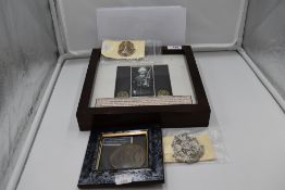 A collection of Border Regiment and similar including framed pair of Collar Badges made into