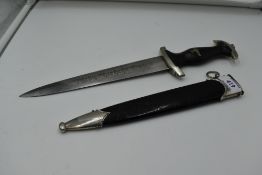 A German SS Officers Dagger c1936, with metal scabbard, black grip with silver eagle and swastika
