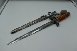 A German Army Officers Dagger c1935 with metal scabbard and silver wire portepee knot, plastic