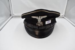 A WW2 SS Allgemeine Visor Cap with badges, named and SS emblem inside, size 58