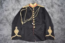 A Victorian British Royal Artillery Captains Dress Tunic in black with red trim having gold