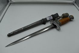 A German Luftwaffe Dagger c1937 with plastic and silver wire grip, pommel decorated with oak leaf