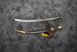 A possible Turkish Ottoman Empire Cavalry Sword having cured blade, brass handle and guard, blade