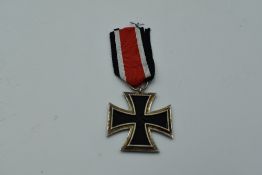 A German WW2 Second Class Iron Cross, Swastika and 1939 on face, 1813 on reverse, with ribbon,