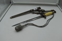 A German Army Officers Dagger c1935 with metal scabbard and silver wire portepee knot, plastic