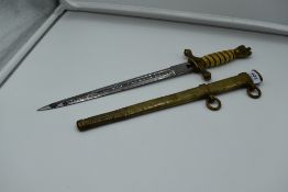 A German WW2 period Kriegsmarine Dagger with scabbard by Puma Solingen, handle chipped, two small