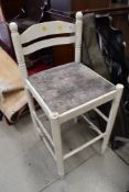 A white work bench or similar stool