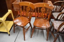 A pair of traditional kitchen chairs