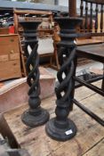 A pair of rustic wooden open twist candlesticks, height approx. 55cm