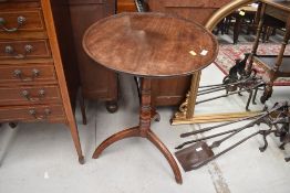 An early 19th Century mahogany pedestal table on oak tripod base