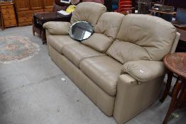 A vintage light brown leather three seater settee, possibly G plan