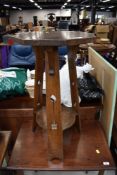 An early 20th Century Arts and Crafts octagonal occasional table, width approx. 40cm, height 72cm