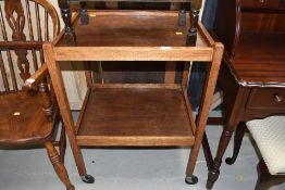 A vintage oak two tier tea trolley, approx. 82 x 47cm