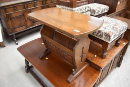 An oak Old Charm style magazine rack table