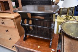 A vintage dark stained magazine table, by Ercol, width approx. 55cm