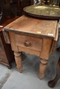 A traditional pine kitcen table having short drop flaps and frieze drawer, width approx. 91cm
