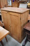 A stripped pine cupboard, approx. dimensions W85 H100 D38cm