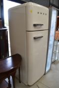 A modern cream Smeg kitchen fridge